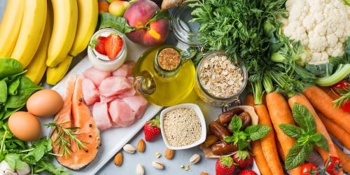 Balanced nutrition concept for DASH clean eating flexitarian mediterranean diet to stop hypertension and low blood pressure. Assortment of healthy food ingredients for cooking on a kitchen table.